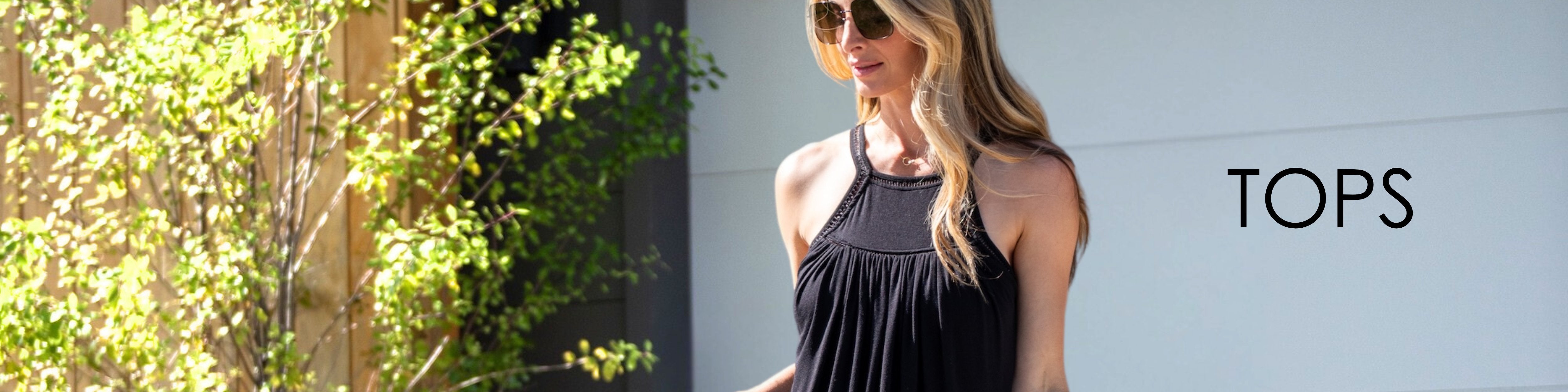 Woman in Jjwinks bra free black Wine Down top with sunglasses